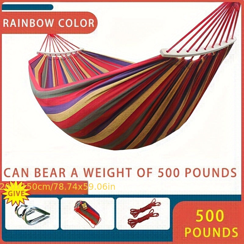 Heavy-duty rainbow canvas hammock for single or double with curved wooden sticks and a weight capacity of 226.8 KG. Includes tree straps for camping, backyard, or patio. High-strength