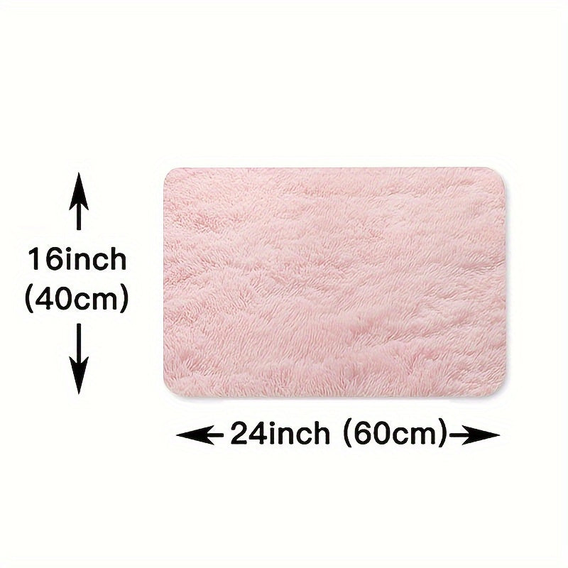 This solid pink polyester area rug is both fluffy and durable, making it perfect for any room in your home or office. The non-slip backing ensures safety, while the stain-resistant material is easy to clean with dry cleaning. This machine-made