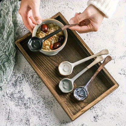 This long-handled Japanese ceramic coffee spoon has a rustic charm and is ideal for stirring tea or coffee. Made of heat-resistant ceramic material, it serves as a stylish accessory for your kitchen and dining experience.