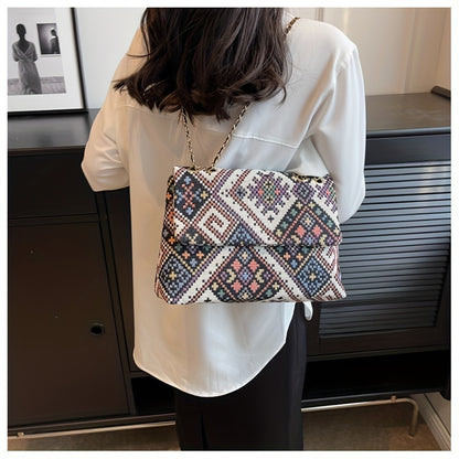 Colorful geometric shoulder bag for women with adjustable strap, magnetic closure, foldable ethnic style, and polyester lining.