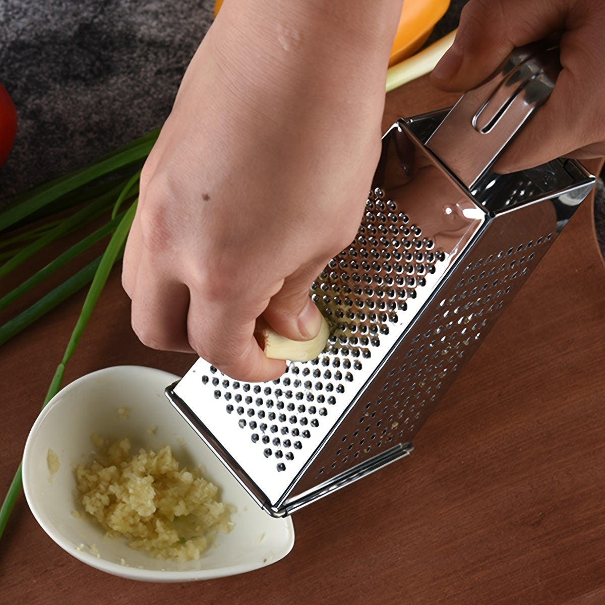 Upgrade your kitchen with the Stainless Steel 4-Sided Box Grater - a versatile tool for grating cheese, vegetables, and potatoes. This multifunctional grater features a non-slip handle for easy use.