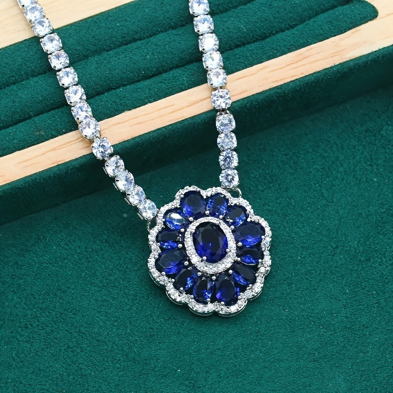 Stunning bridal jewelry set featuring 4 pieces made of luxurious white gold plated copper and adorned with blue cubic zirconia. Set includes a necklace, earrings, and an adjustable ring, ideal for weddings and special events.