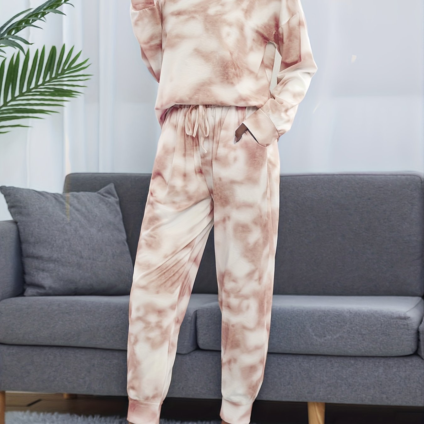 Tie dye lounge set for women, with long sleeve top and elastic waistband pants.