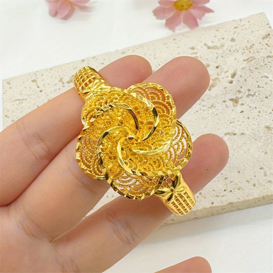 Middle Eastern inspired jewelry, this luxury vintage floral bracelet features a large hollow-out flower design and is made of 24K golden plated copper. Perfect for weddings and parties, this bracelet is suitable for all seasons and does not include any