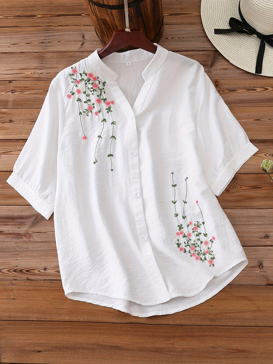 Floral embroidered women's blouse with v-neck and short sleeves, made of rayon and polyamide. Machine washable, ideal for spring and summer.