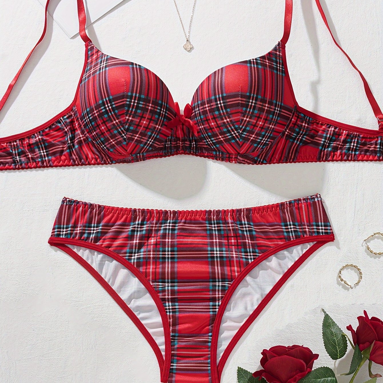 Plaid lingerie set for women made of 95% polyester and 5% elastane. Features medium support bra and mid-rise briefs in color block design. No chest pad included. Part of adult lingerie