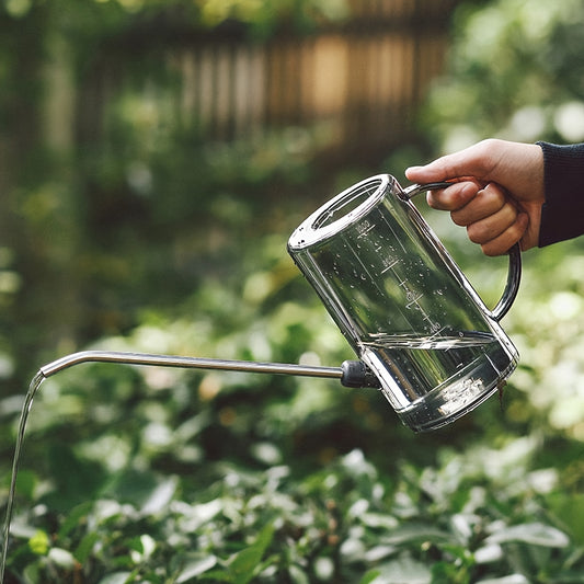 Stainless steel long spout watering can for household and garden use.