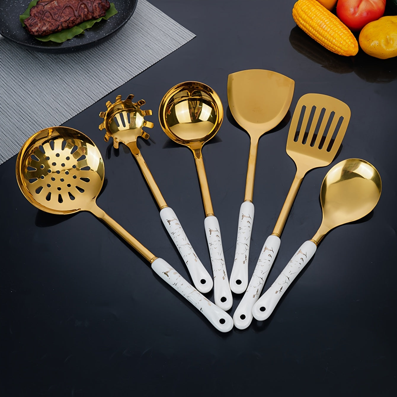 Set of seven pieces of stainless steel kitchenware, consisting of essential kitchen supplies.