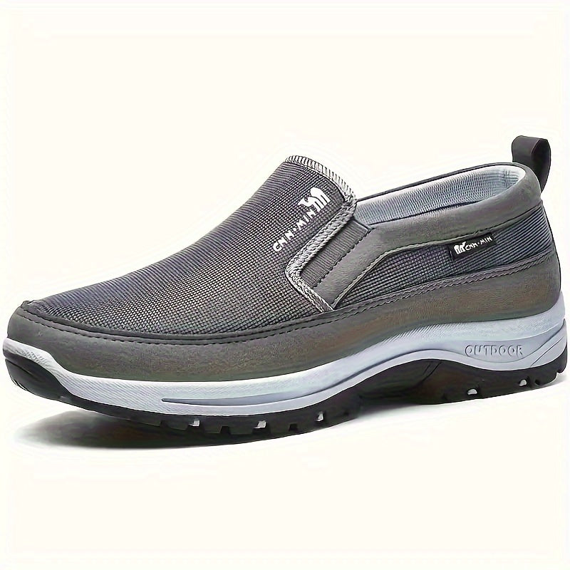 Comfortable men's slip-on sneakers with soft sole, breathable fabric, and stylish design for everyday wear.