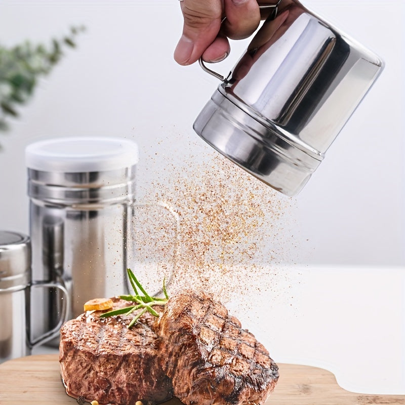 Multipurpose stainless steel spice jar with handle and lid, perfect for storing sugar, cinnamon, pepper, salt, and spices in homes, cafes, and restaurants.