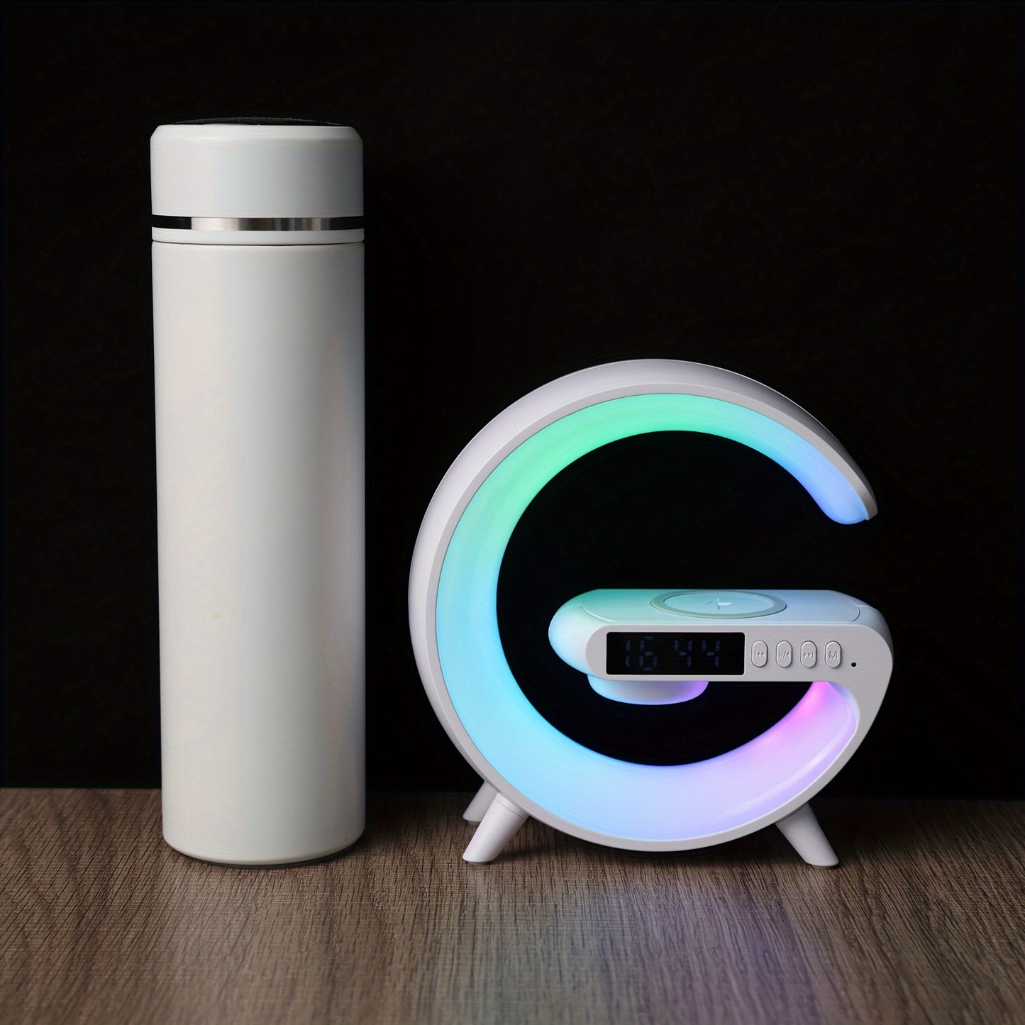 Smart lamp with wireless phone charging, RGB night light, alarm clock, and bedside table lamp.