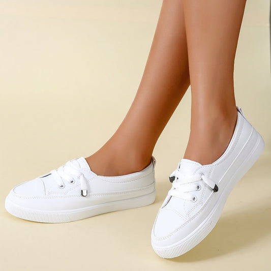 White slip-on sneakers for women with minimalist design and soft rubber sole, perfect for casual wear in all seasons.