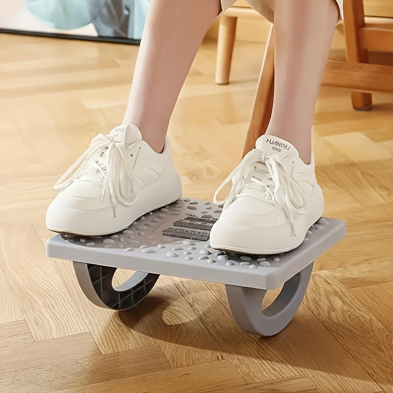 Ergonomic black under-desk footrest with adjustable plastic leg support for office and home comfort.