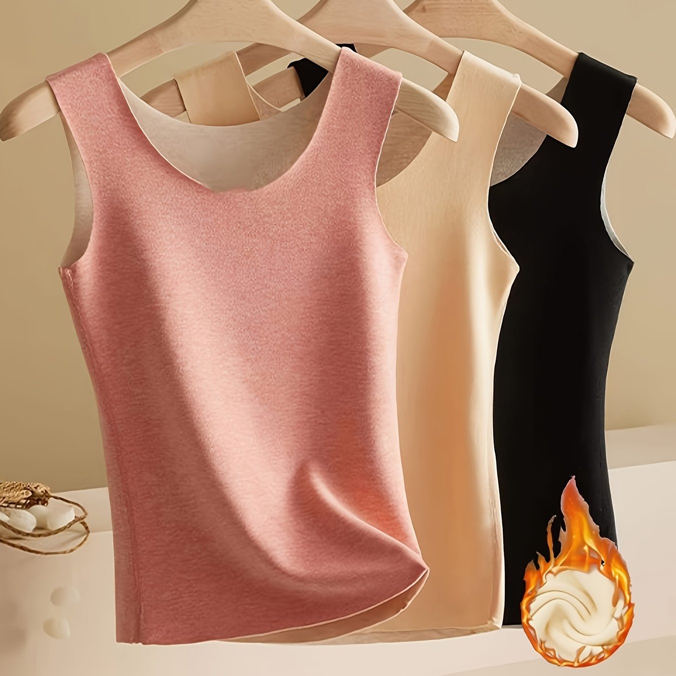 3 pieces of plush-lined thermal underwear with a warm, sleeveless tank top.