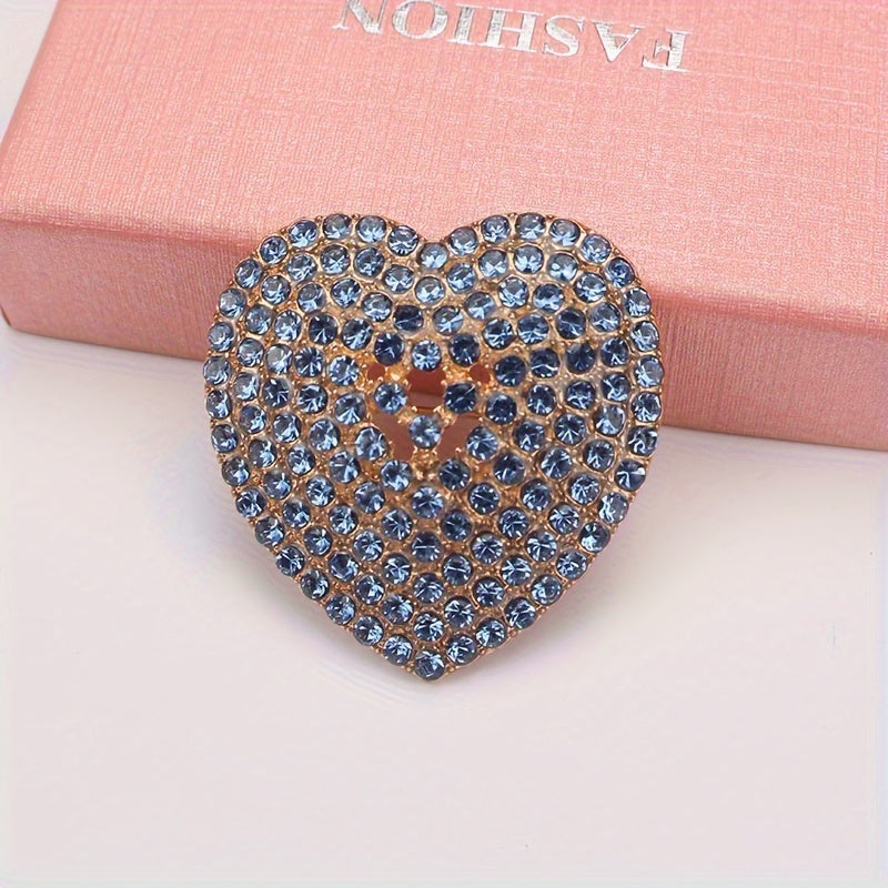 Heart-shaped brooch embellished with sparkling rhinestones - a stylish lapel pin for women's attire, perfect for adding charm to dresses, coats, sweaters, and corsages.