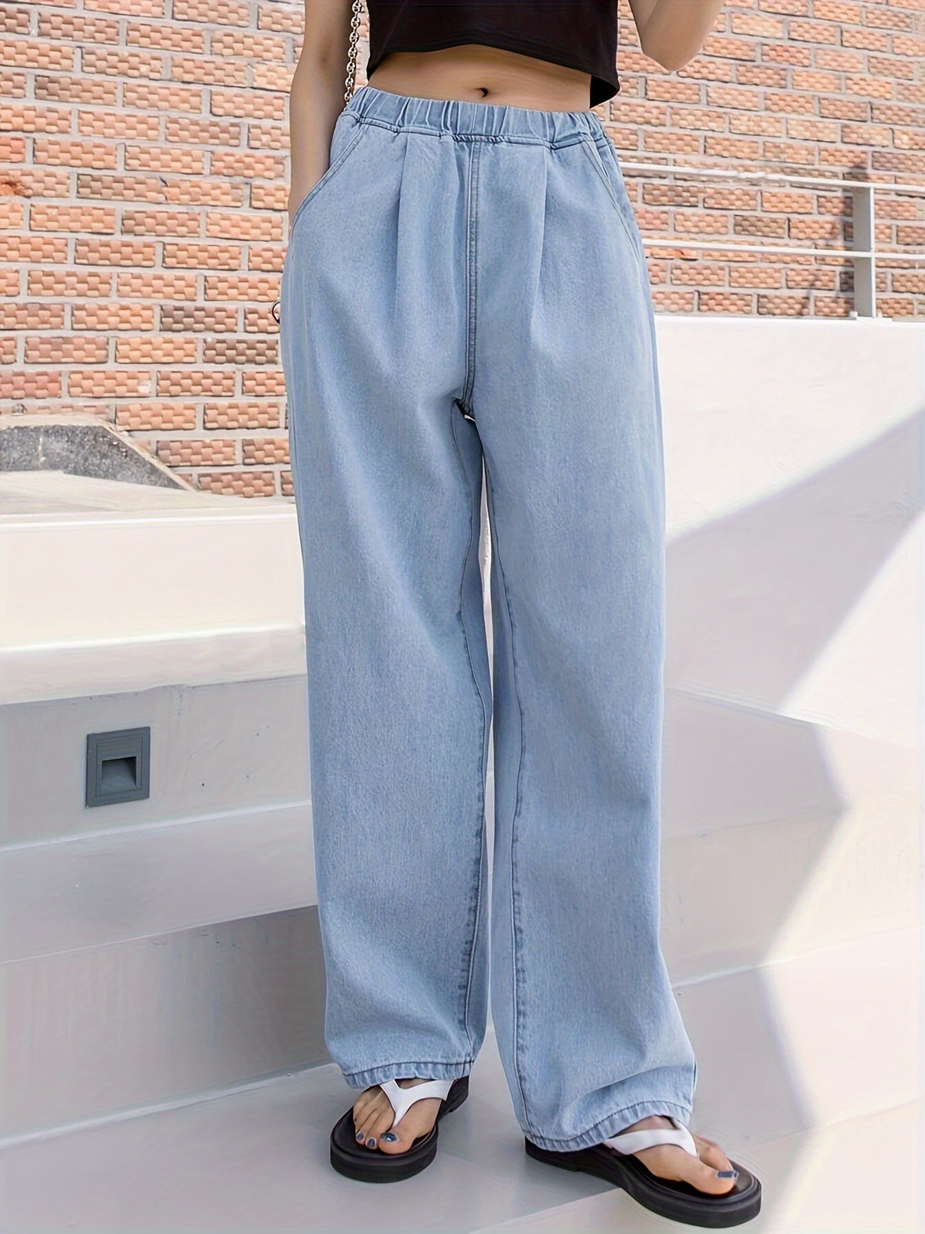 Loose straight leg jeans for plus size women with multiple pockets. Versatile denim pants for casual wear.