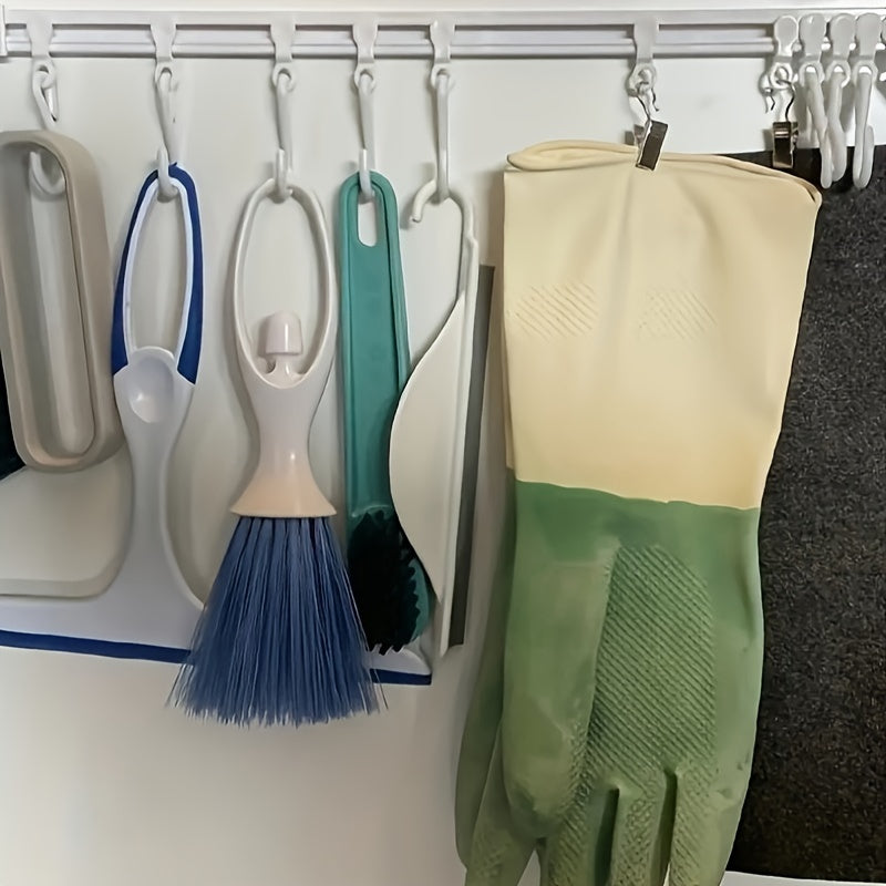 Kitchen storage rack with sliding hooks for easy installation, no drilling necessary; adhesive backing for convenient organization and utility hooks.