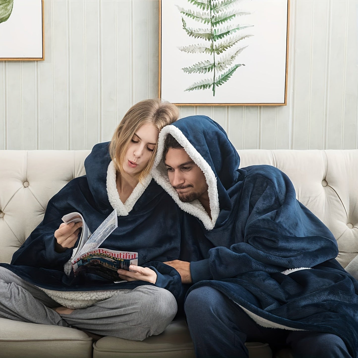 Stay warm and stylish in our cozy plaid fleece hooded blanket sweatshirt! With large pockets for convenience, this oversized wearable blanket is perfect for men and women. It's soft, warm, and machine washable, making it ideal for TV binge-watching.