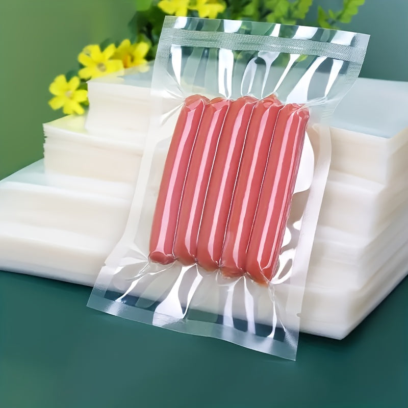 50 or 100 pieces of Textured Vacuum Food Packaging Bags, perfect for commercial evacuation storage and compression. These plastic sealing bags feature a mesh design for keeping food fresh. Ideal for household and kitchen use, these vacuum bags are