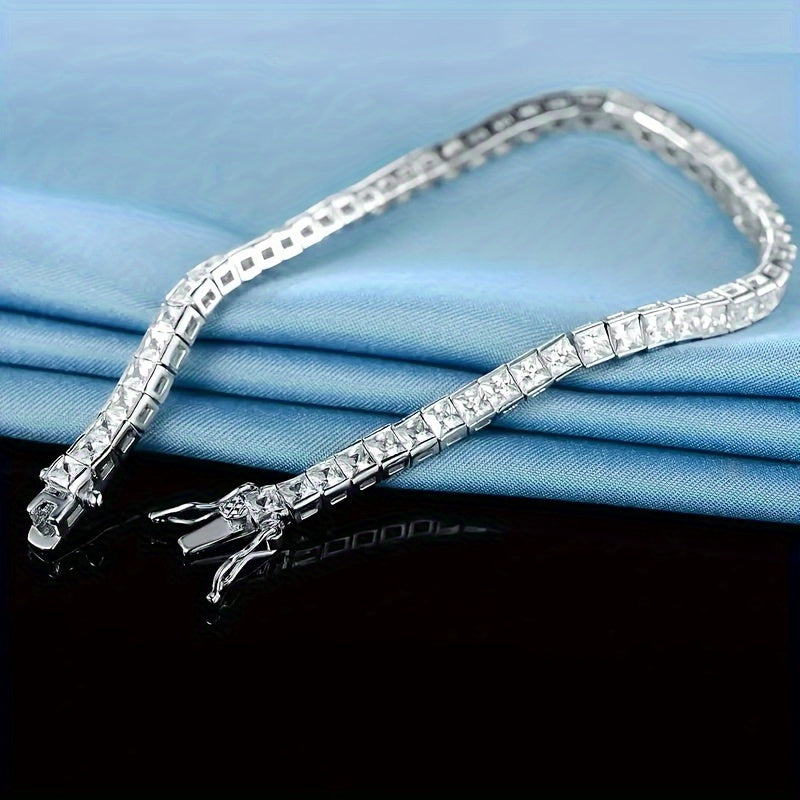 Get noticed with this sophisticated and chic 925 Sterling Silver Plated Moissanite Square-Cut Tennis Bracelet, a versatile piece perfect for everyday wear or special occasions. Give the gift of elegance this Valentine's Day with this timeless accessory