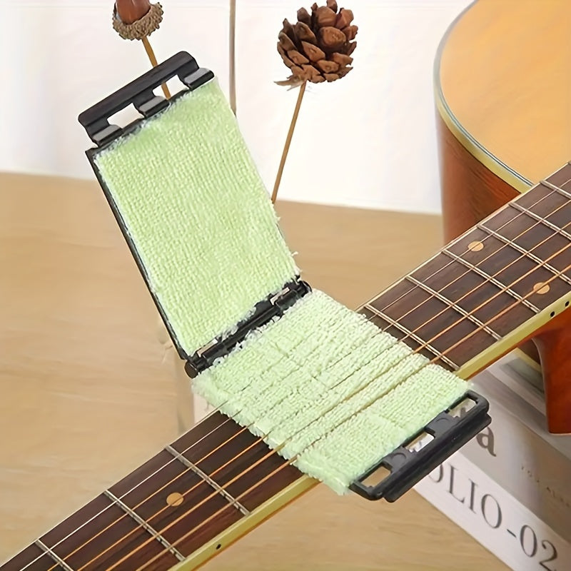 Premium guitar string cleaner with durable ABS fingerboard cloth. Textured surface ideal for acoustic, bass, ukulele, and electric guitars. Easy maintenance tool in guitar cleaning kit.