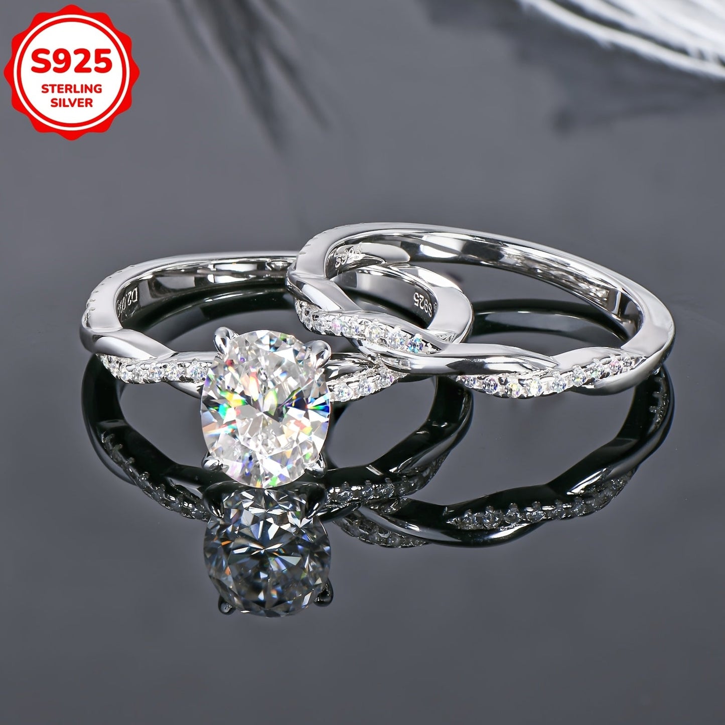 Weight: 5.48 grams, Main Stone: Oval 7x9mm Moissanite, Main Stone Weight: 2 carats, Set of 925 Pure Silver Women's Rings featuring a Moissanite main stone. The set includes a Moissanite Wedding Ring, Women's Wedding Ring, Engagement Ring with a twist arm