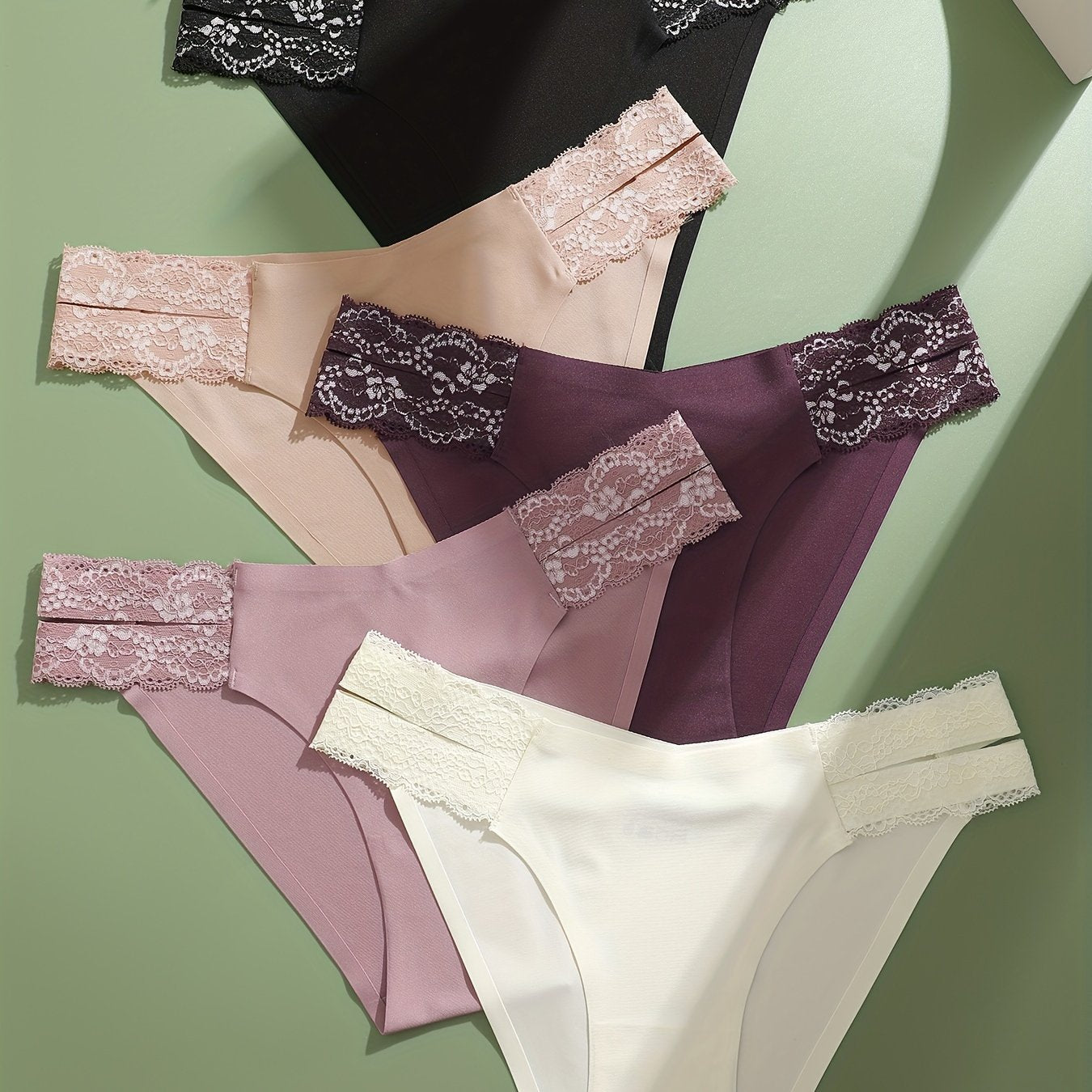 5-pack of low-rise briefs with lace detail, made of polyester, polyamide, and elastane blend knit fabric in solid color, weighing 169 gsm