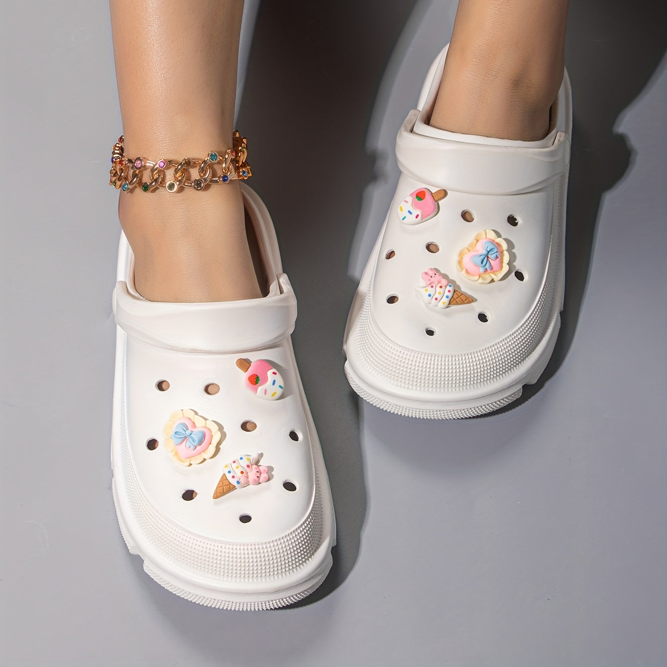 Women's cute cartoon clogs with round toe and breathable design for comfortable wear.