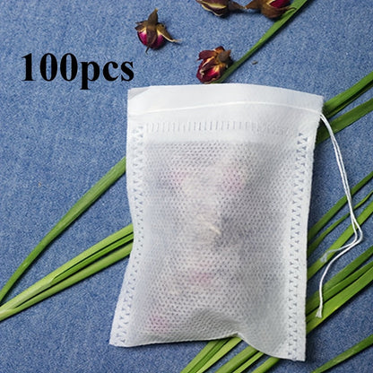 Pack of 100 transparent non-woven tea bags with drawstring, perfect for loose leaf tea and herbs. Convenient disposable pouches for storing and steeping your favorite blends.