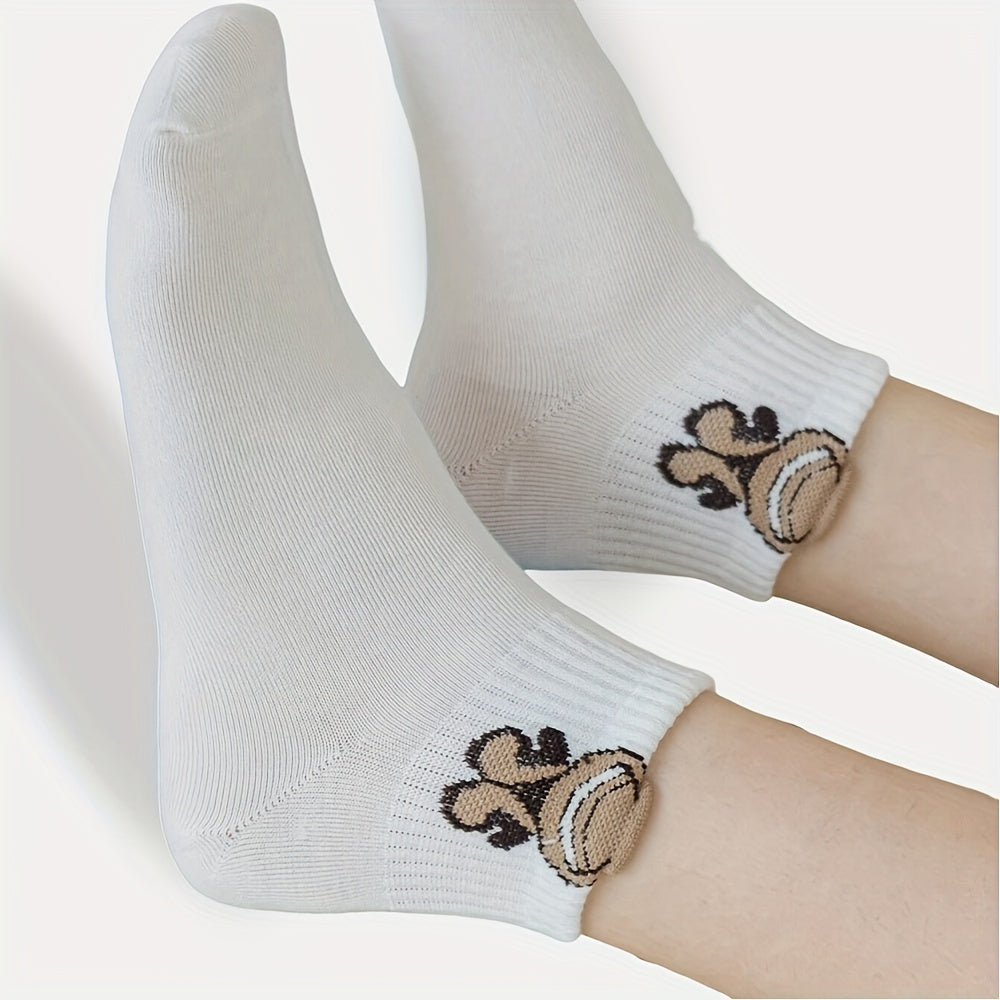 5 pairs of cute cartoon print white socks for women, soft and breathable.