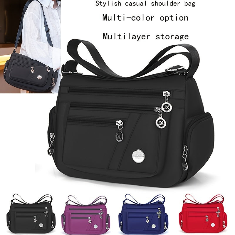 Stylish waterproof nylon crossbody bag with adjustable strap and multi-layer design, ideal for daily commute and travel.