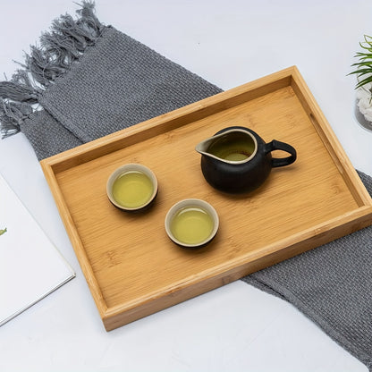 Bamboo serving tray with handles for eating, working, and storing in various locations.