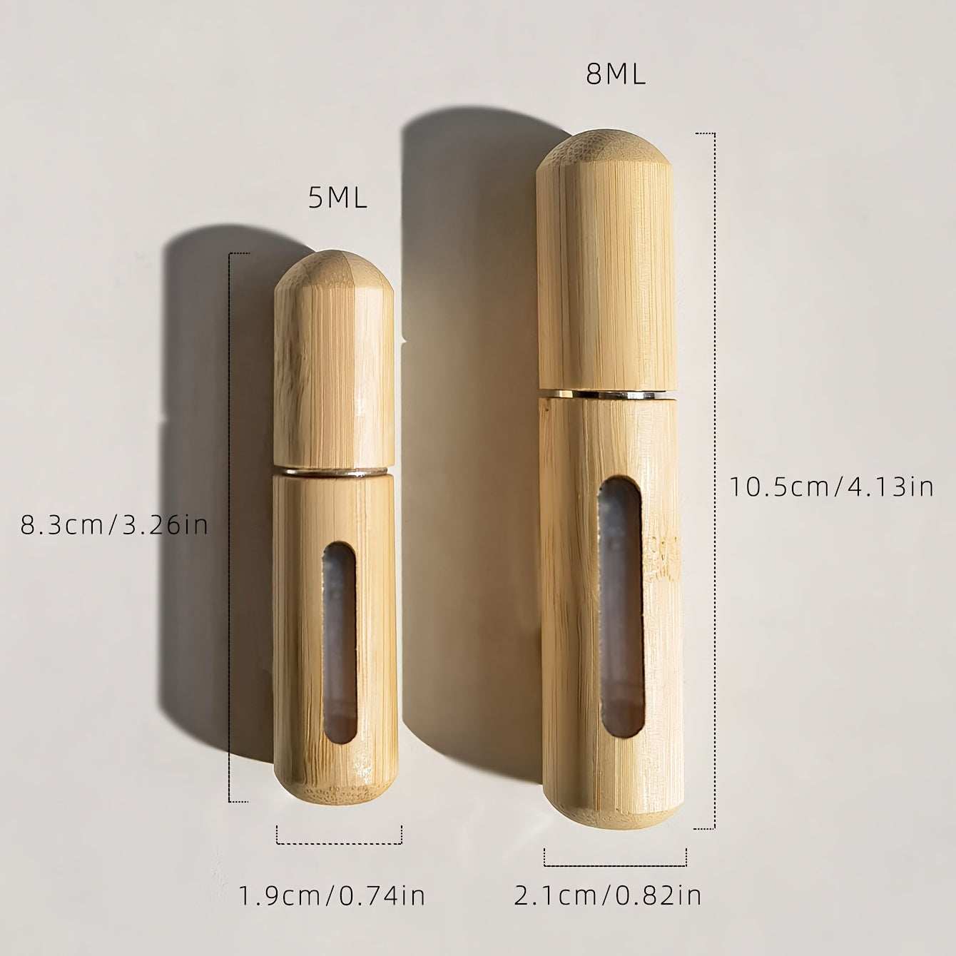 Set of bamboo shell perfume atomizers, refillable spray bottles in 5ml & 8ml sizes. Portable and luxurious fragrance dispensers with visible window, ideal for travel and outdoors.