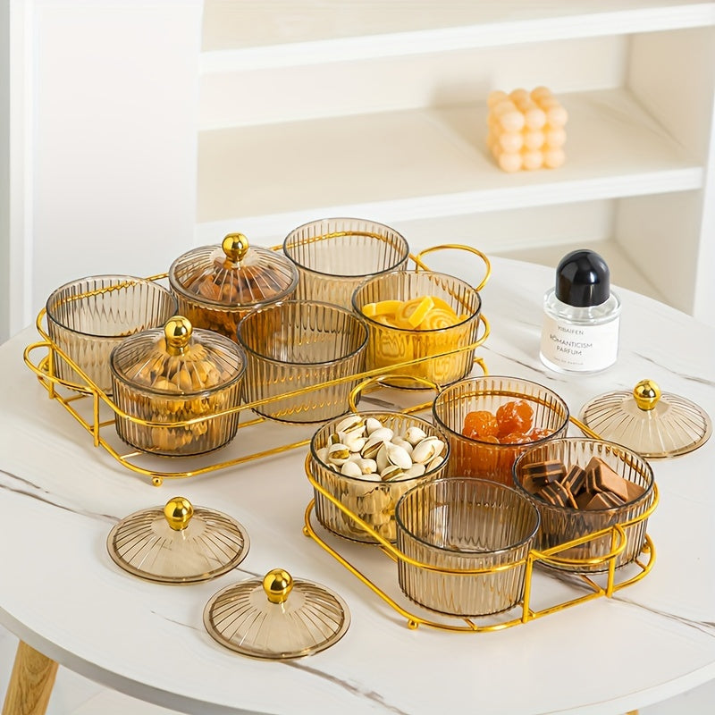 Luxurious snack serving set with lid-covered plastic dishes on a golden tray, perfect for displaying dried fruits and candies on a living room coffee table.