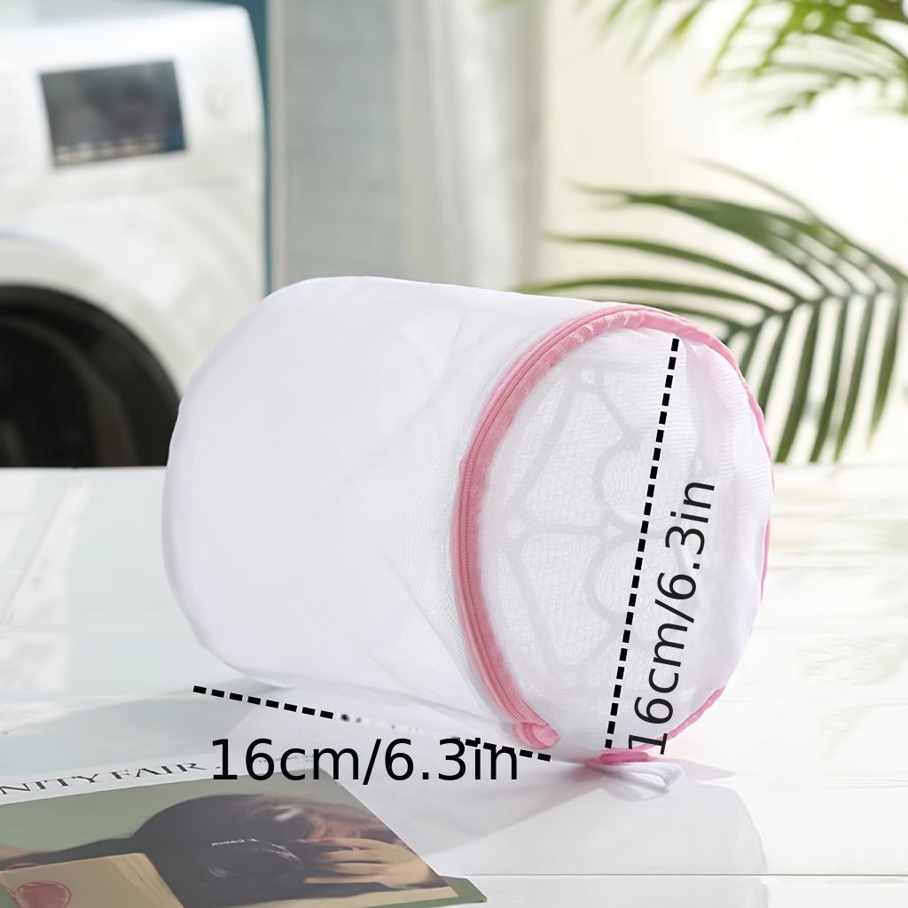 Pink zipper polyester mesh laundry bag, machine wash safe, anti-deformation for delicates and underwear, hexagonal pattern, laundry room accessory.