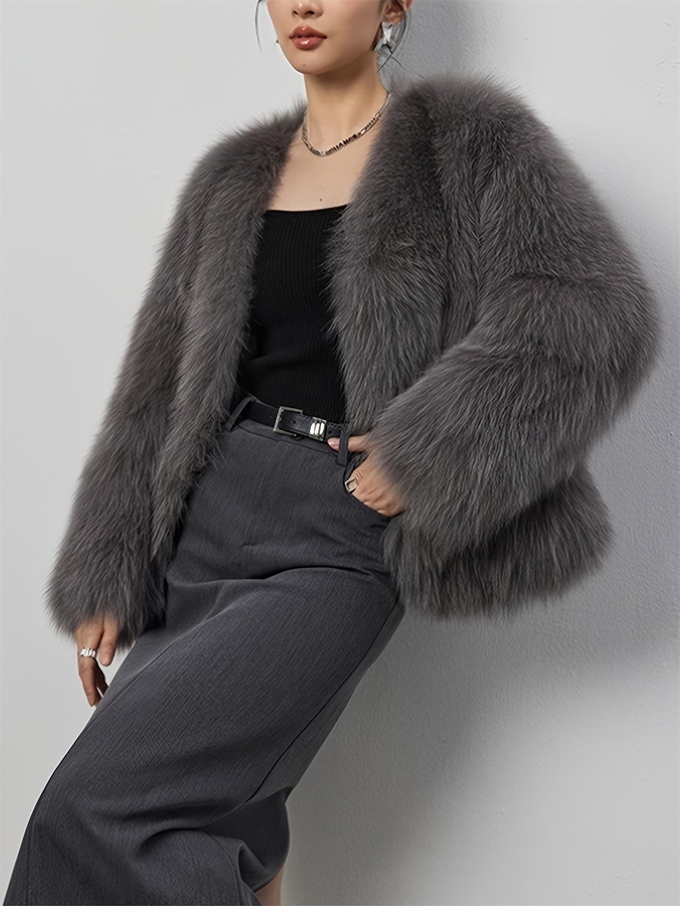 Stylish women's coat in light gray faux fur with fluffy collar, perfect for cold weather