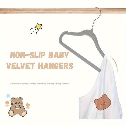 The HOUCOC 20-piece Velvet Hangers Set is Perfect for Organizing Kids' Clothing in the Closet - Non-Slip and Space-Saving Solution for Pants, Shirts, and Dresses for Children and Teens.