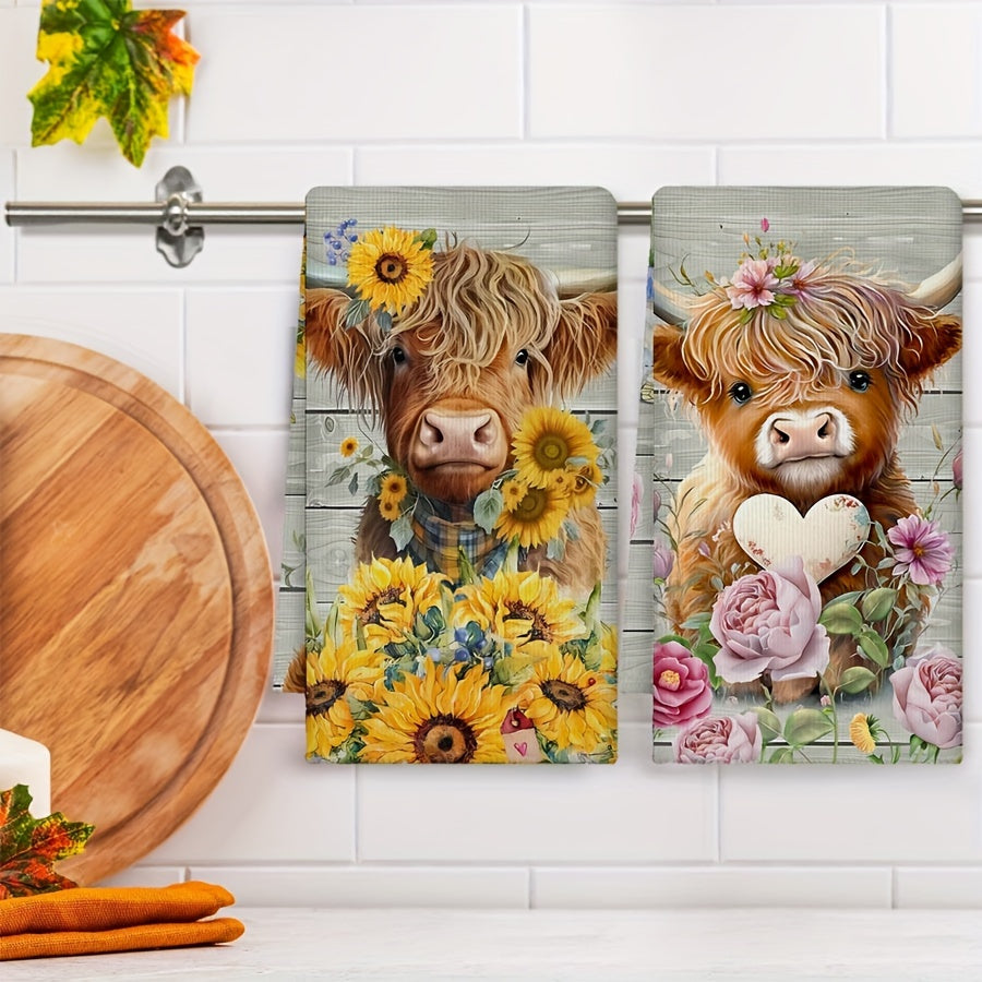 Set of two colorful hand towels with sunflower cow pattern, farmhouse style. Perfect for kitchen or bathroom use.