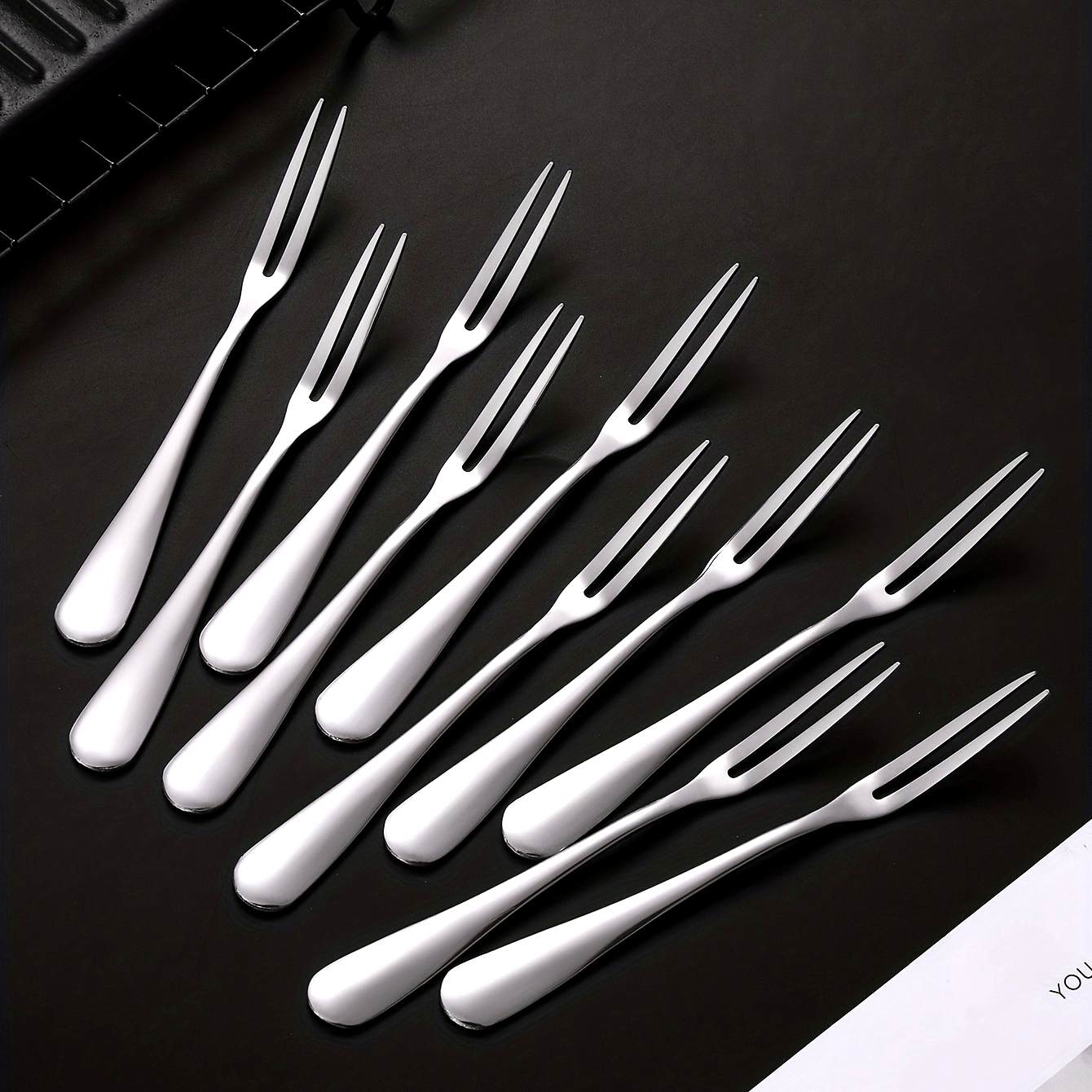 Stainless steel fruit forks for desserts and salads, modern and reusable.