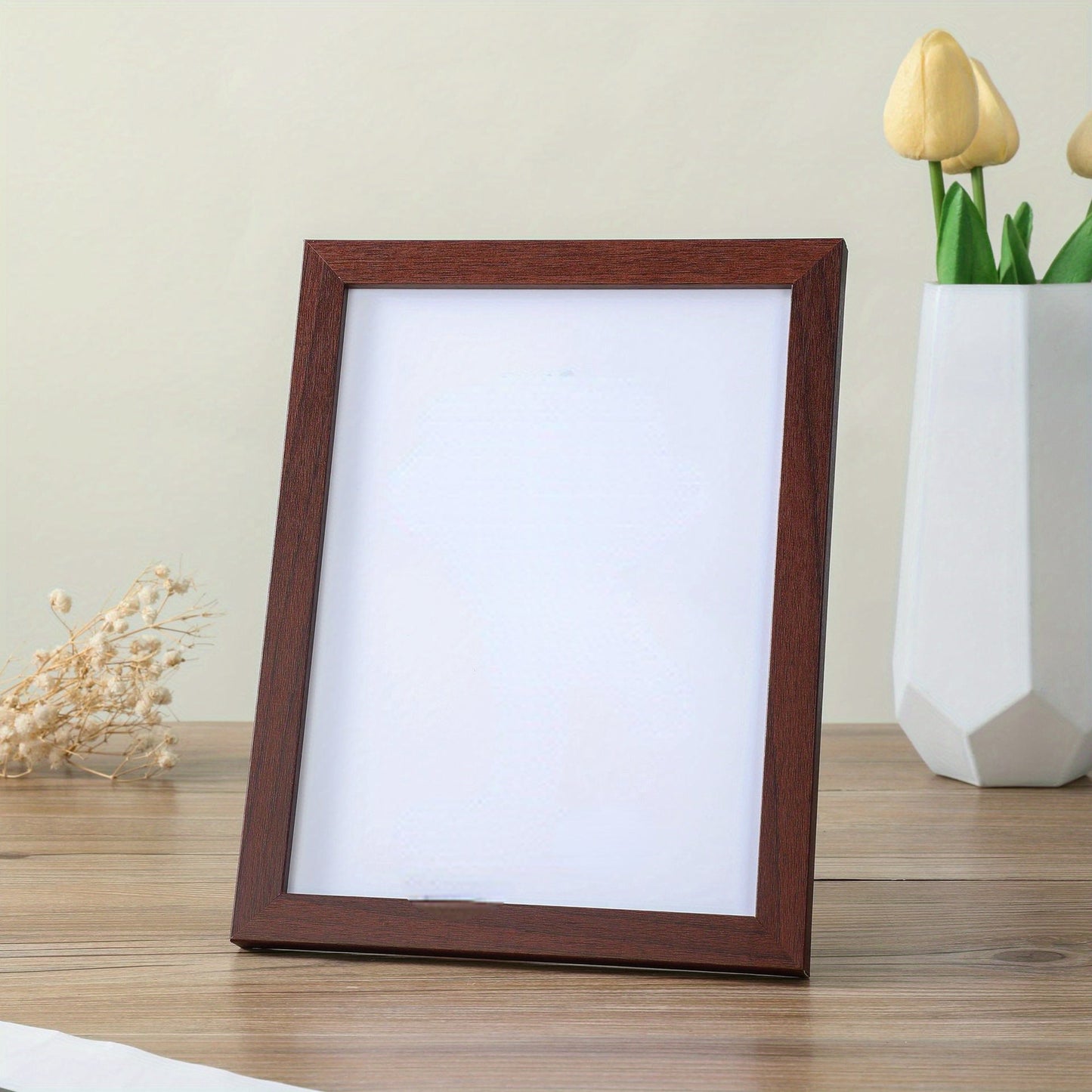 Wooden frame suitable for pictures ranging from 5 to 8 inches, designed for wall mounting. Perfect for studio photos.