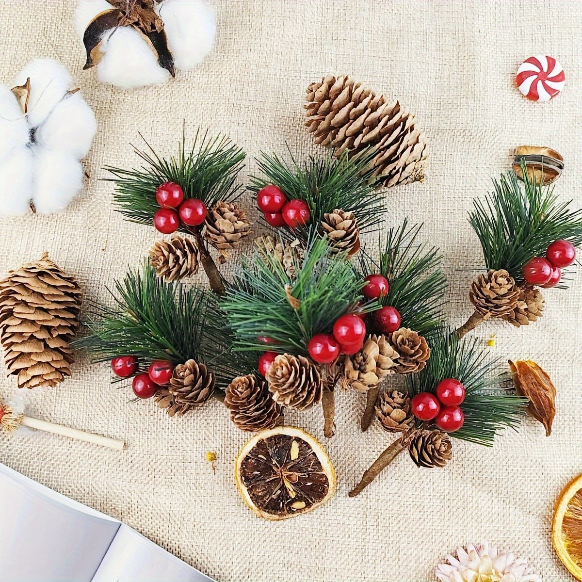 24 artificial pine picks with red berries and pinecones, perfect for DIY wreaths and seasonal decor.