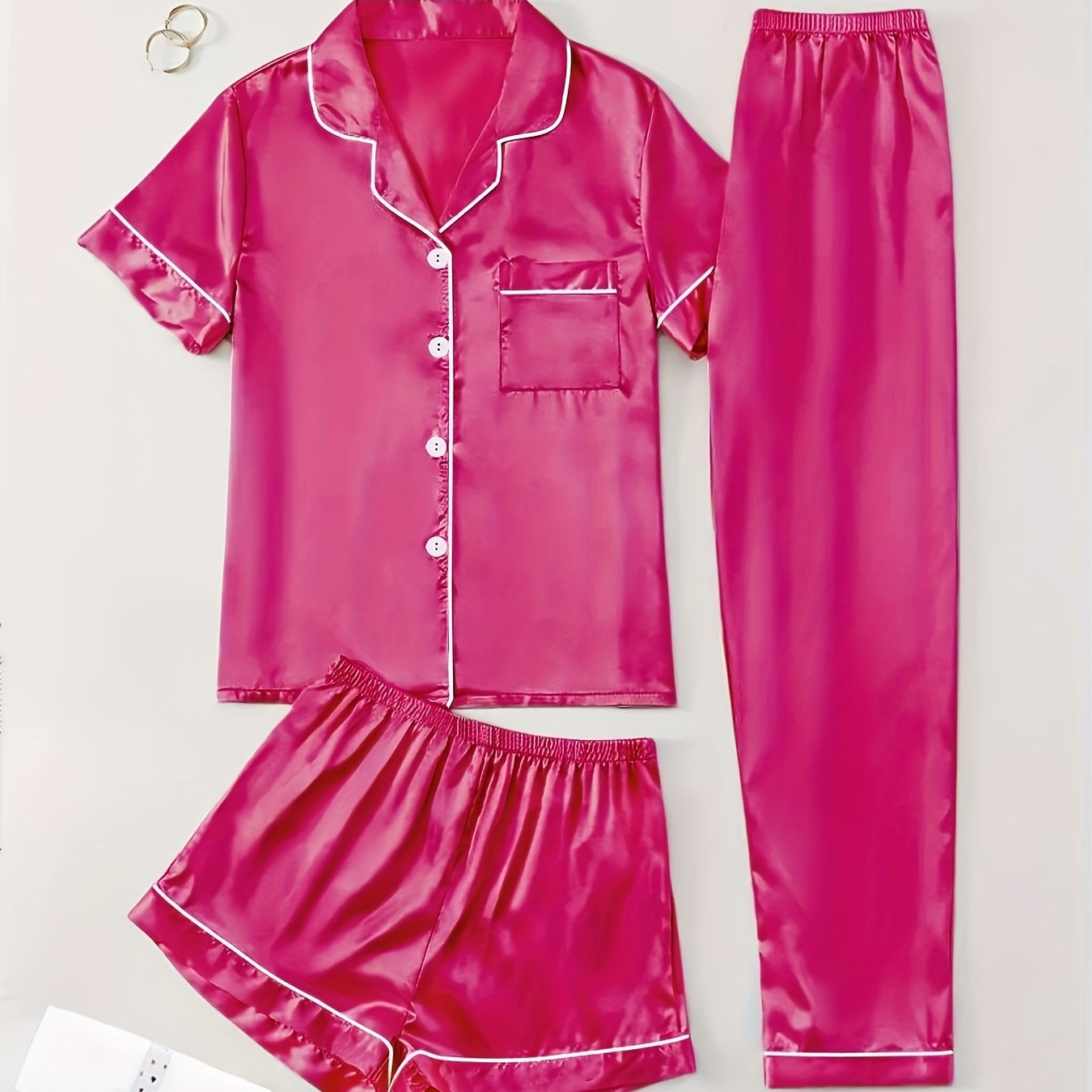 3-piece summer satin pajama set for women featuring collared shirt, long pants, and shorts. Made of 95% polyester and 5% elastane. Available in sizes S-XL.