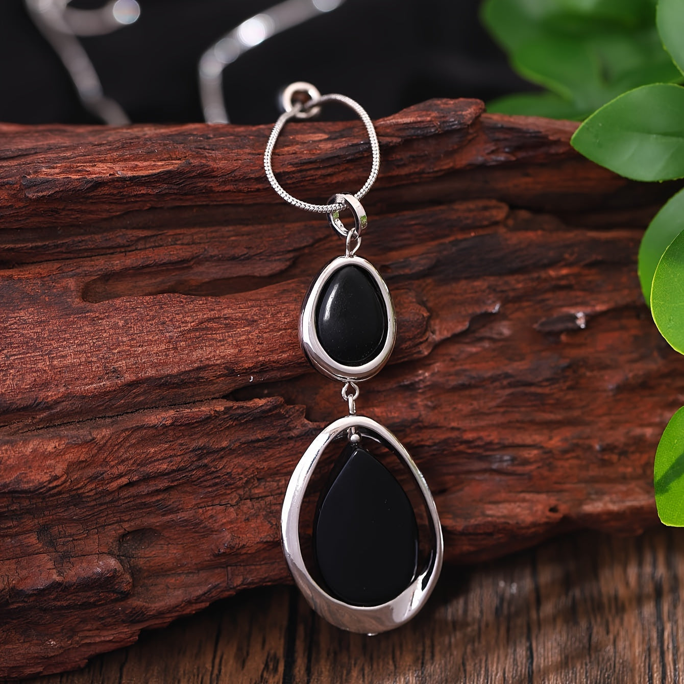 A stylish and sophisticated black stone geometric pendant necklace, perfect for women's accessories. Made from trendy zinc alloy, this long necklace is ideal for daily wear, parties, proms, vacations, and makes a great jewelry gift.