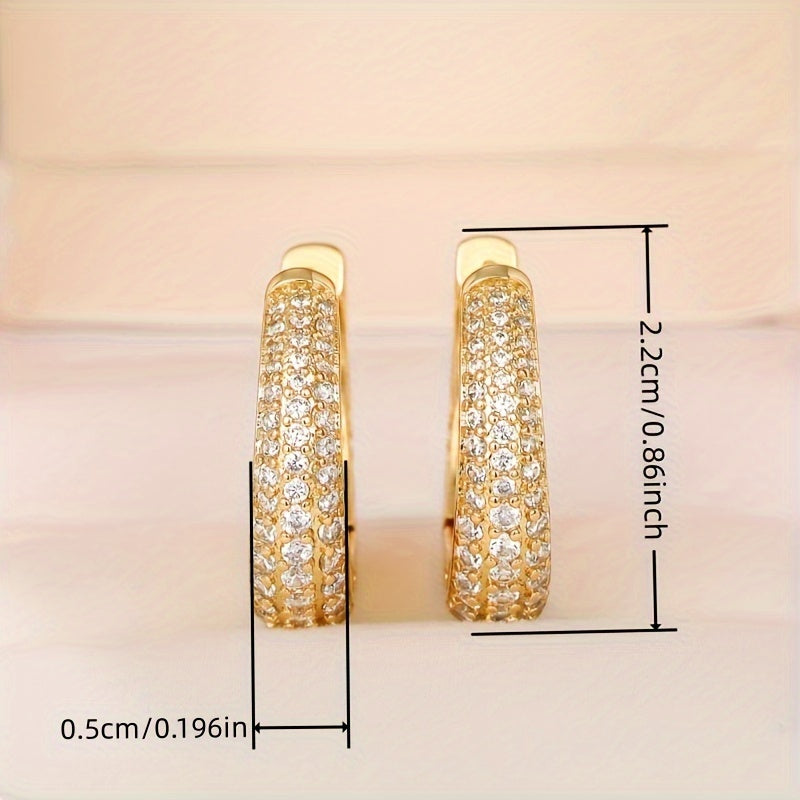 Vintage-style golden hoop earrings with sparking zirconia inlays, crafted from copper material, make a sophisticated and elegant gift for women.