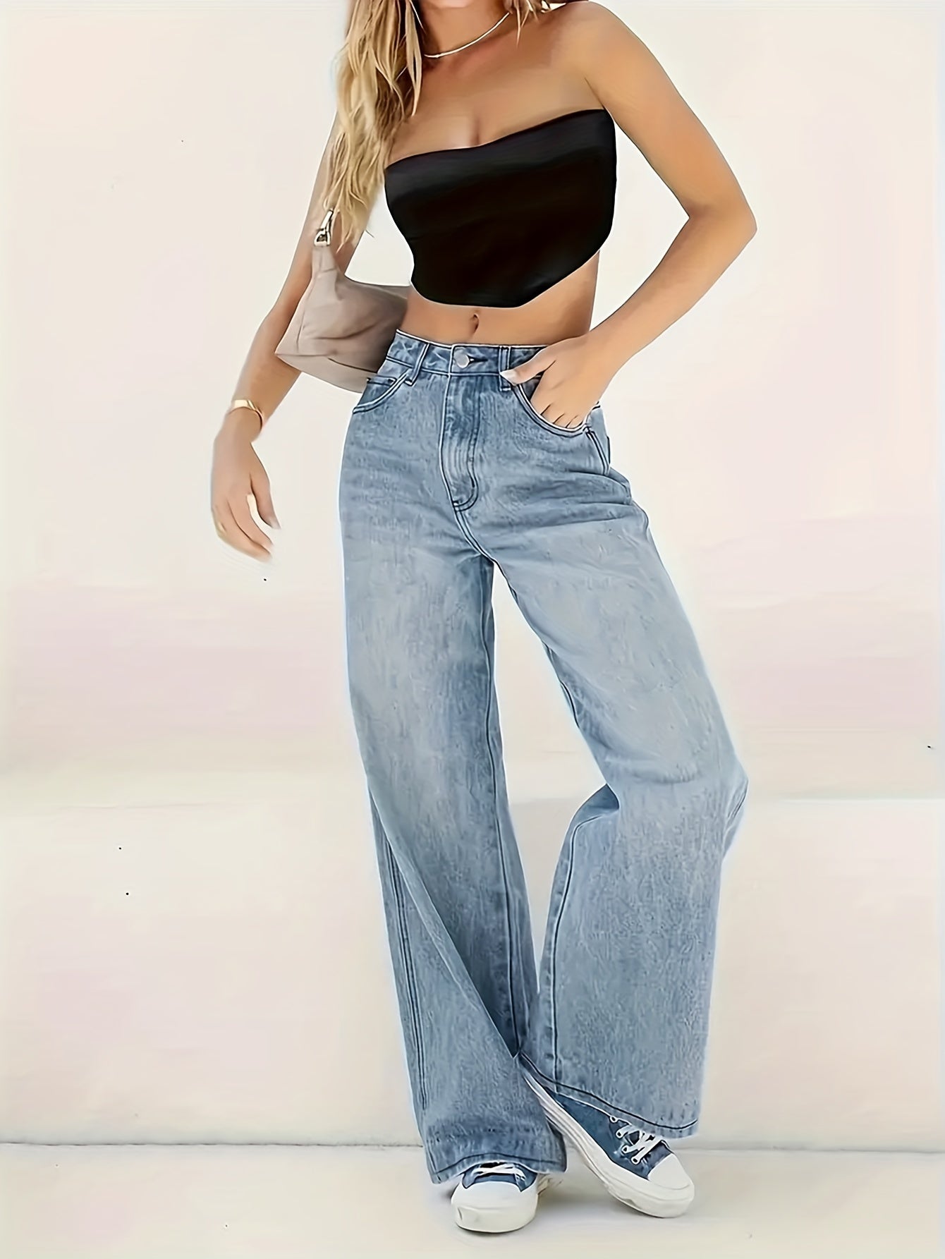 Women's wide leg jeans in plain washed blue denim, comfortable and classic design.