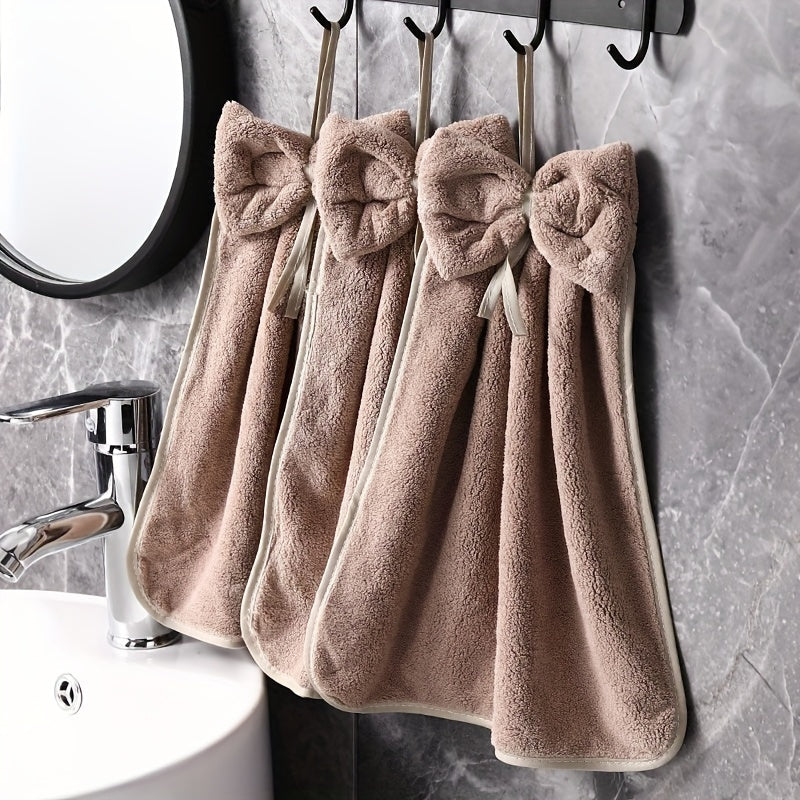 3-piece kitchen towel set with bowknot skirt pattern. Absorbent and quick-drying for household cleaning. Ideal kitchen essentials.