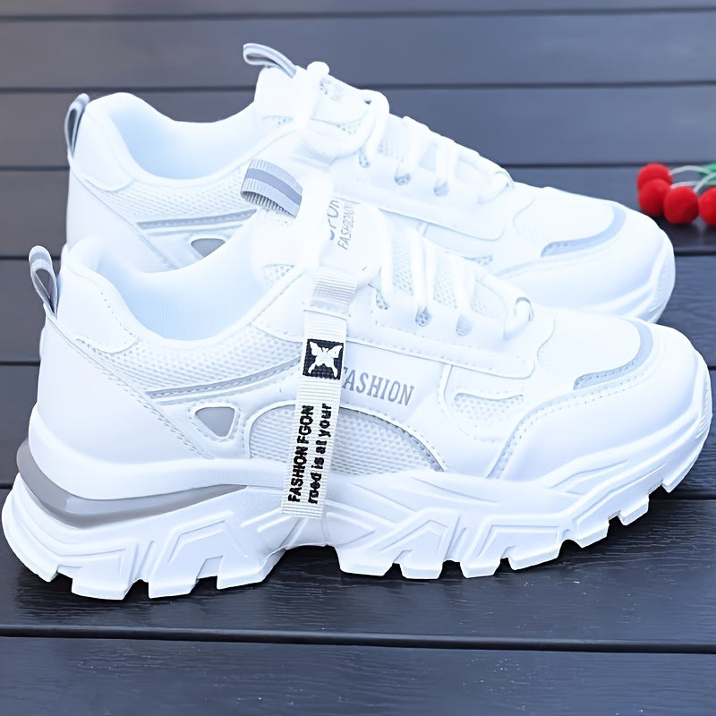 Women's white sneakers with low top lace-up, mesh upper, breathable fabric insole, and durable PVC sole for casual and sporty wear. Casual and trendy footwear.