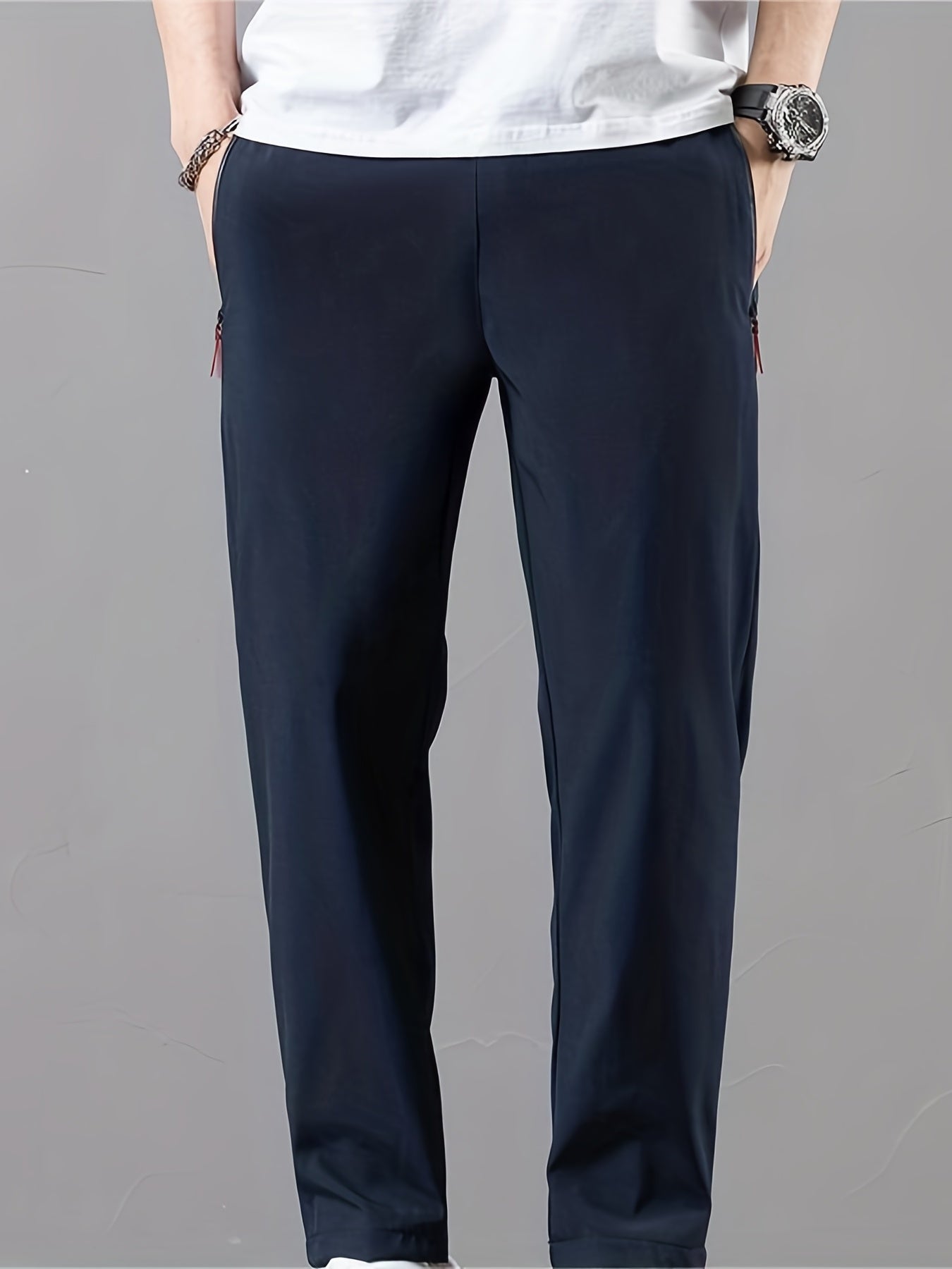 Casual men's pants with stretch, drawstring and zipper for spring and summer sports.