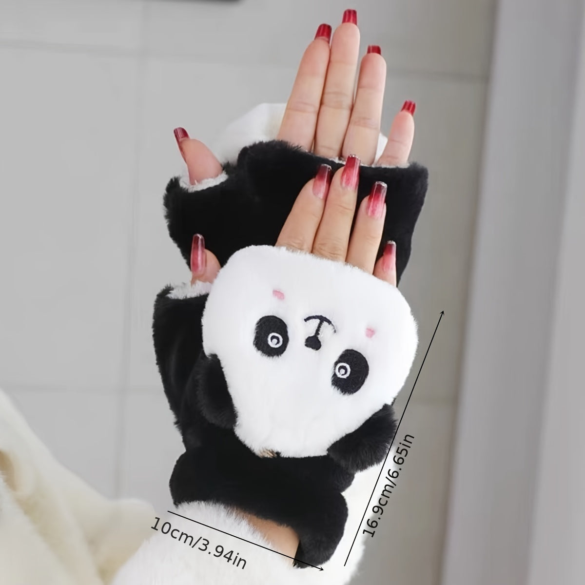 One pair of adorable animal cartoon-themed women's polyester winter mittens with flip tops. These thick, plush fingerless mitts provide warmth and decoration, perfect for casual weekend use. The embroidered design adds a touch of charm to this