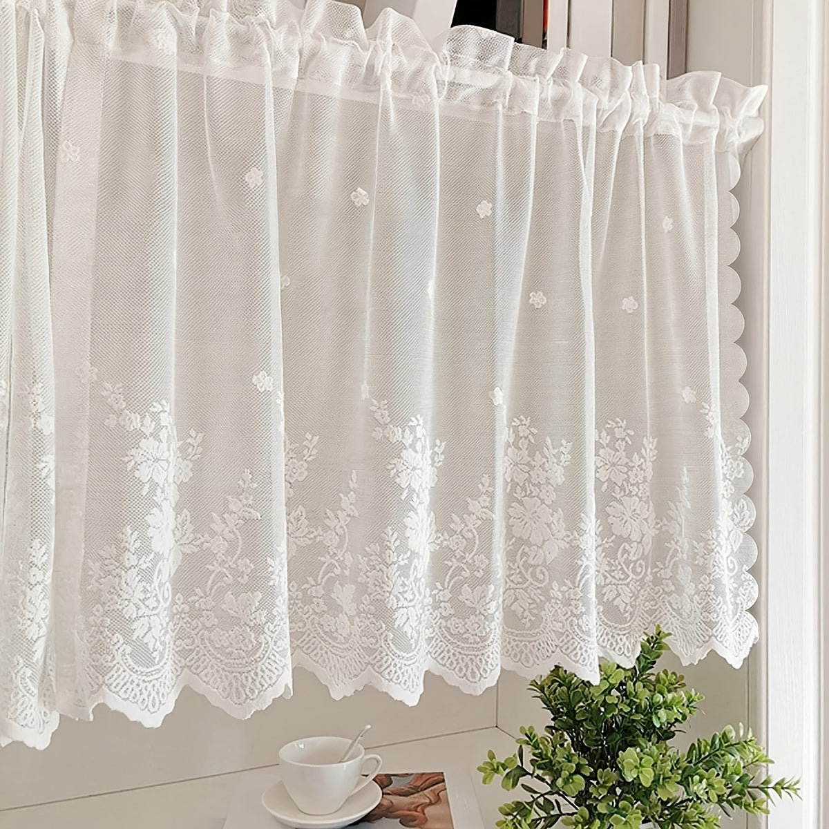 Elevate your space with this elegant black floral lace cafe curtain. Featuring a sweet and simple design, this curtain is made of sheer polyester and has a rod pocket for easy installation. Perfect for adding a touch of sophistication to your kitchen